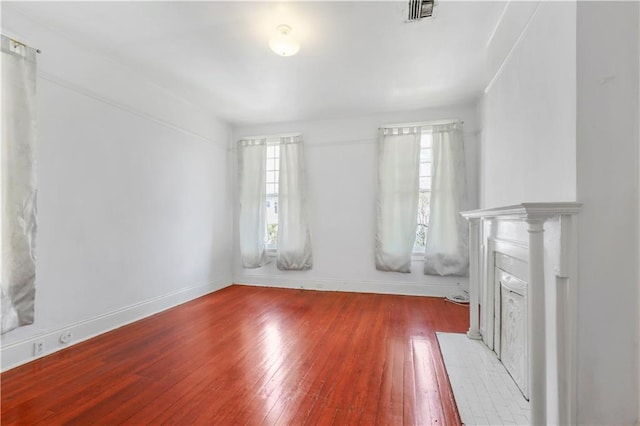 unfurnished living room with wood-type flooring