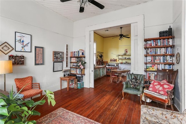 living area with hardwood / wood-style flooring and ceiling fan