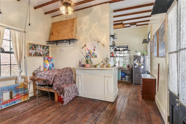 kitchen with beam ceiling, ceiling fan, stainless steel fridge, and dark hardwood / wood-style flooring