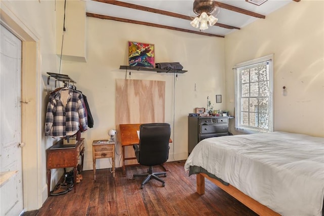 bedroom with dark hardwood / wood-style floors and beamed ceiling