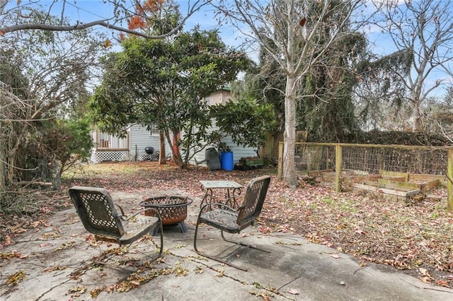 view of patio featuring a fire pit