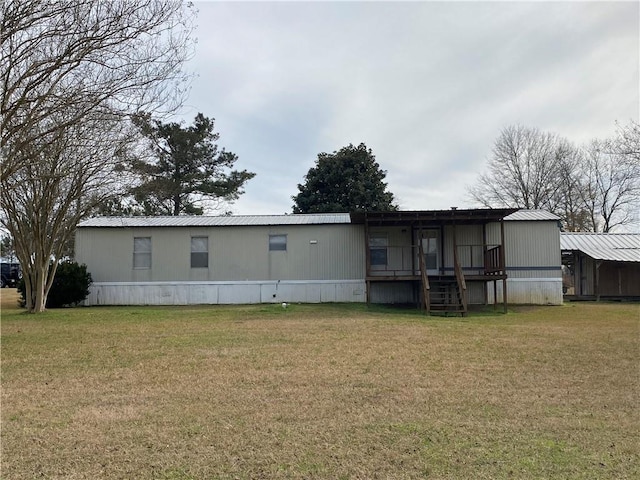 68443 S River Rd, Kentwood, LA 70444 - back of house featuring a yard