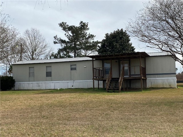68443 S River Rd, Kentwood, LA 70444 - rear view of property with a yard