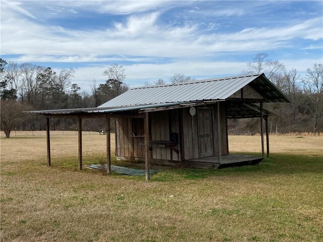 68443 S River Rd, Kentwood, LA 70444 - view of outdoor structure featuring a yard