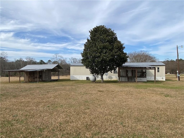 68443 S River Rd, Kentwood, LA 70444 - view of yard with an outbuilding