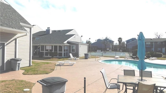 view of swimming pool featuring a patio