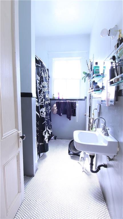 53032 Esplanade Ave, New Orleans, LA 70116 - full bathroom featuring a sink