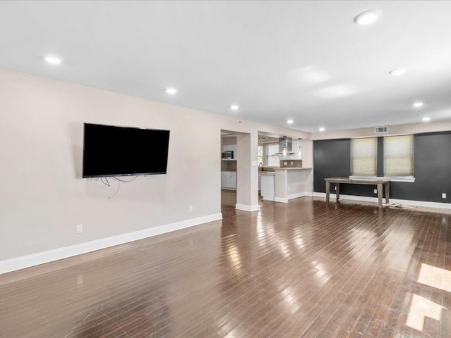 unfurnished living room with hardwood / wood-style floors