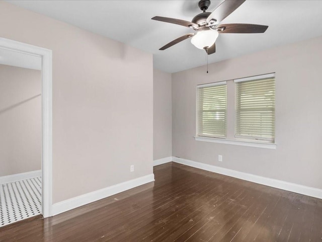 unfurnished room with ceiling fan and dark hardwood / wood-style floors