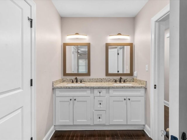 bathroom with vanity and hardwood / wood-style floors