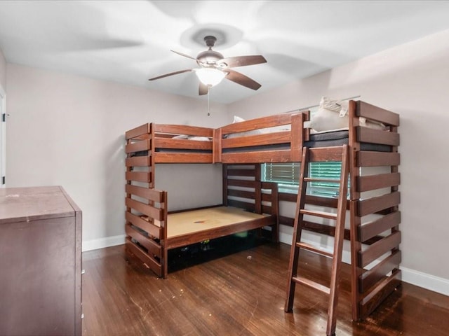 bedroom with dark wood-type flooring