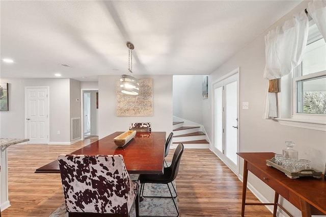 dining area with light hardwood / wood-style flooring