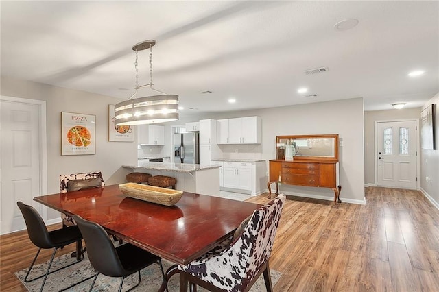 dining room with light wood-type flooring