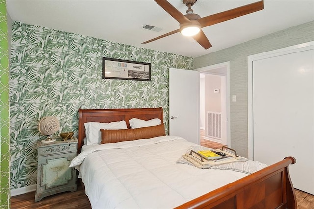 bedroom with hardwood / wood-style floors and ceiling fan