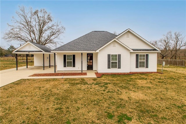 ranch-style home with a carport, covered porch, and a front yard