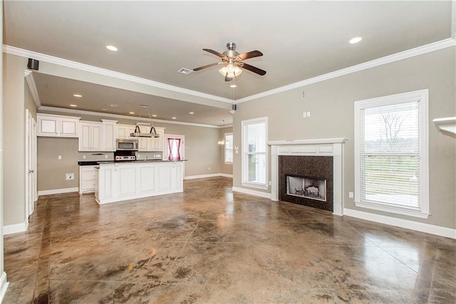 unfurnished living room featuring crown molding, a fireplace, concrete floors, and ceiling fan