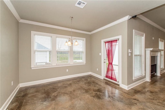 foyer entrance featuring ornamental molding and a chandelier