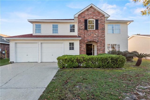 view of property featuring a garage and a front yard