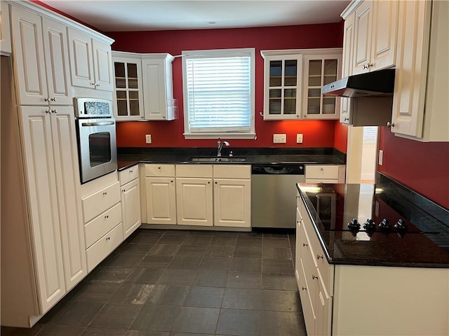 kitchen with white cabinetry, appliances with stainless steel finishes, and sink