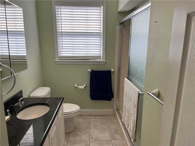 bathroom with walk in shower, vanity, radiator, a healthy amount of sunlight, and tile patterned flooring