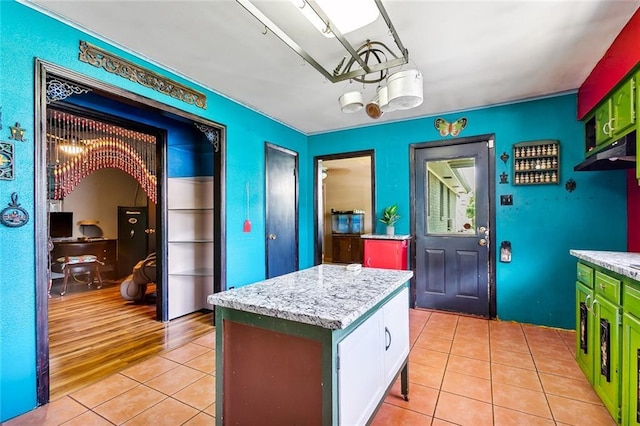 kitchen featuring light tile patterned floors and a center island