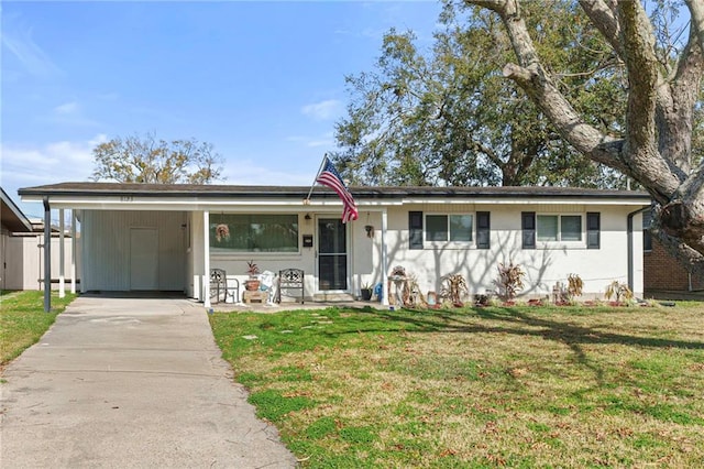 ranch-style house featuring a front yard and a carport