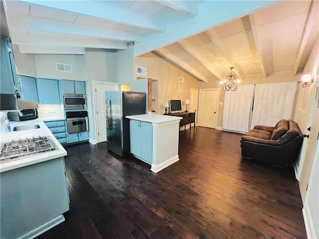 kitchen with blue cabinetry, vaulted ceiling with beams, dark hardwood / wood-style floors, a notable chandelier, and stainless steel appliances