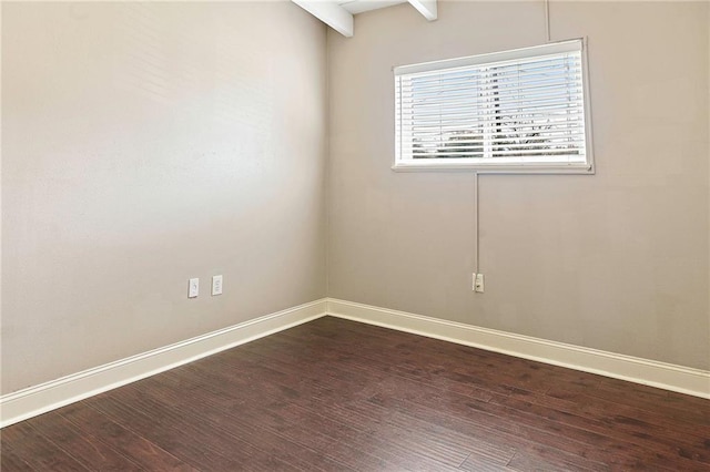 spare room featuring dark hardwood / wood-style flooring