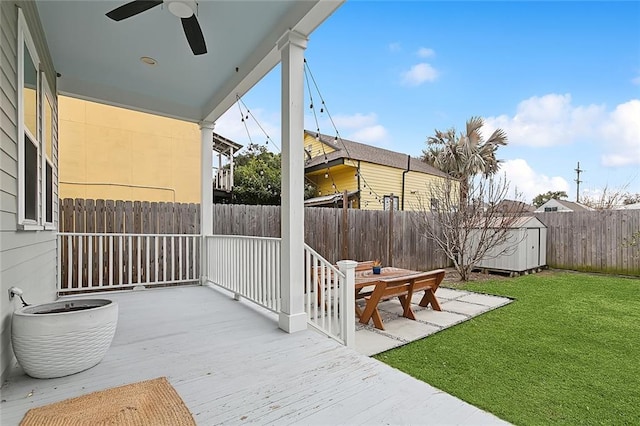 view of patio with a shed and ceiling fan