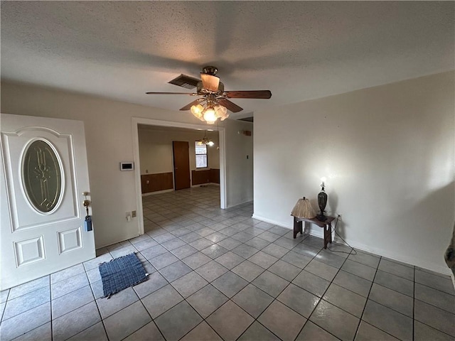 204 Magnolia Ave, La Place, LA 70068 - tiled foyer entrance featuring ceiling fan and a textured ceiling