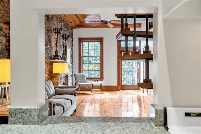 sitting room featuring wood ceiling, ceiling fan, wood-type flooring, and high vaulted ceiling