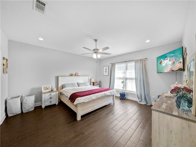 bedroom with dark wood-type flooring and ceiling fan