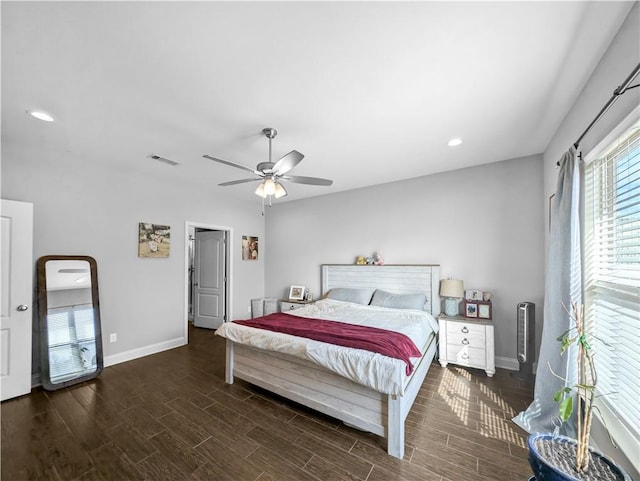 bedroom with dark wood-type flooring and ceiling fan