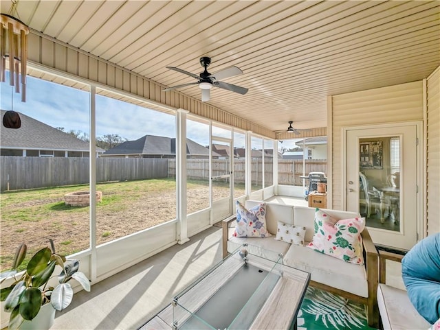 sunroom with plenty of natural light and ceiling fan