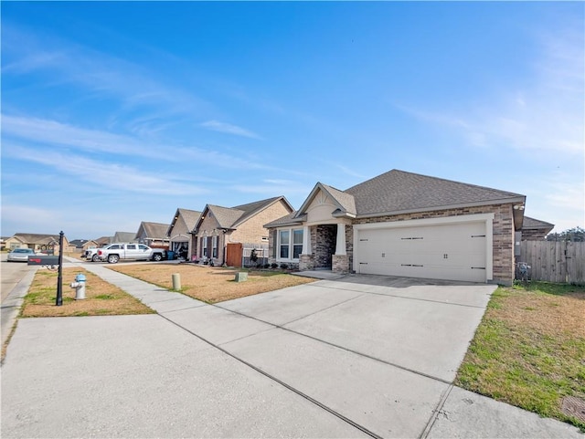 ranch-style house featuring a garage and a front lawn