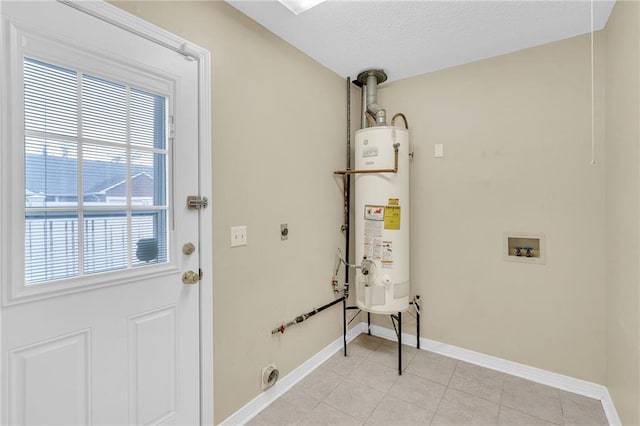 laundry area with light tile patterned floors, hookup for an electric dryer, hookup for a washing machine, and gas water heater