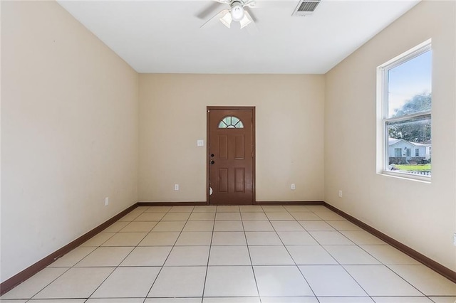 interior space with ceiling fan