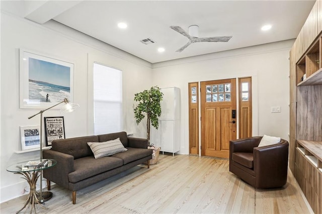 living room featuring ceiling fan and light hardwood / wood-style flooring