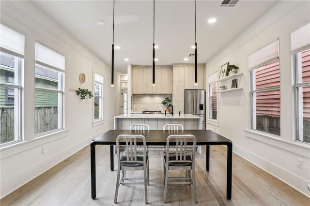 dining area with light wood-type flooring