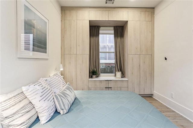 bedroom with light wood-type flooring