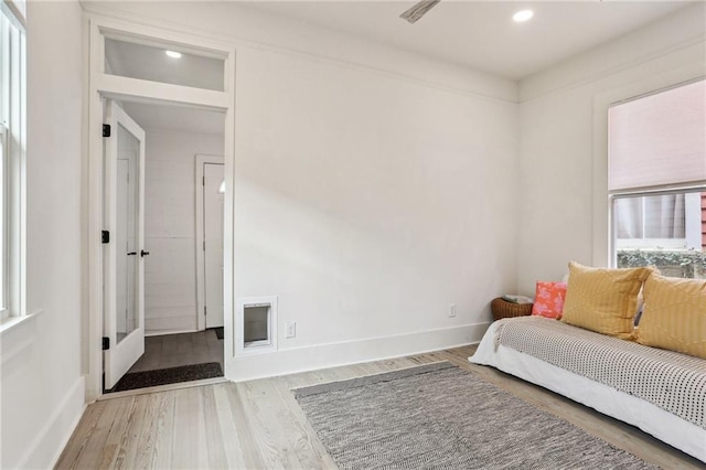 living area with hardwood / wood-style floors