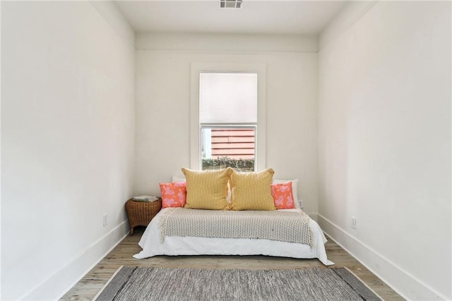 bedroom featuring hardwood / wood-style floors