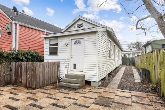 bungalow featuring a patio