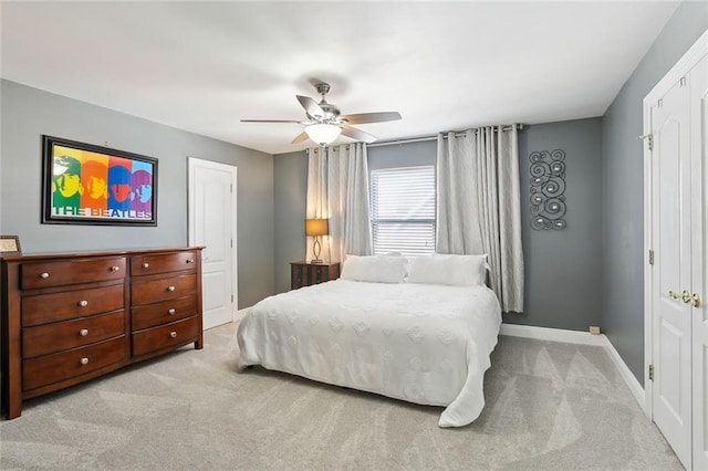 carpeted bedroom featuring ceiling fan