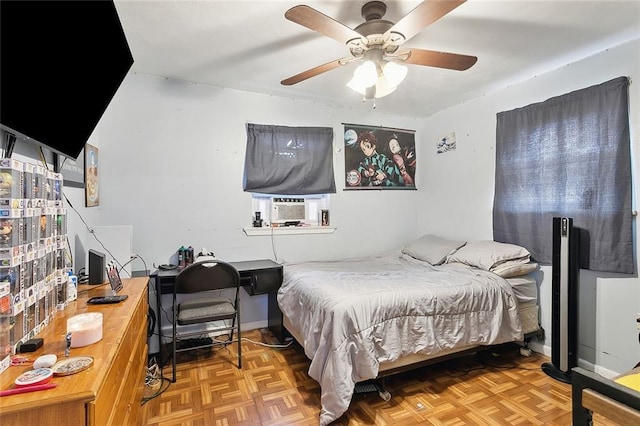 bedroom with parquet floors, ceiling fan, and cooling unit