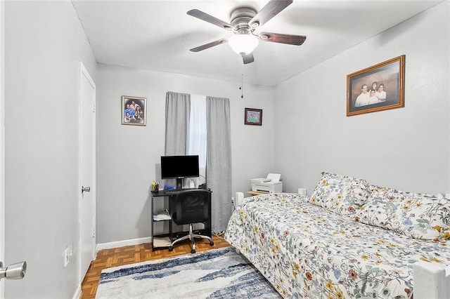 bedroom with parquet floors and ceiling fan