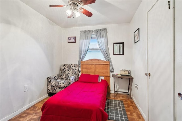 bedroom with parquet floors and ceiling fan