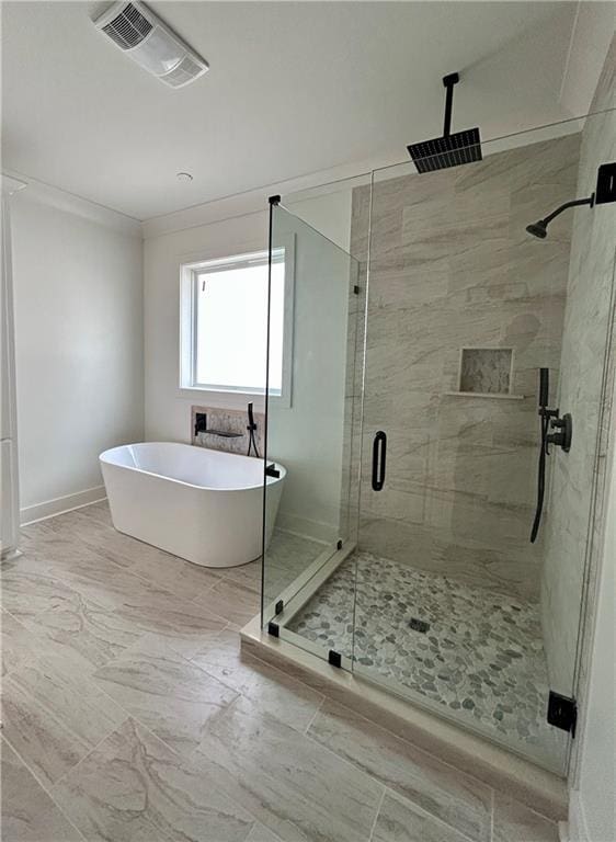 bathroom featuring crown molding and plus walk in shower