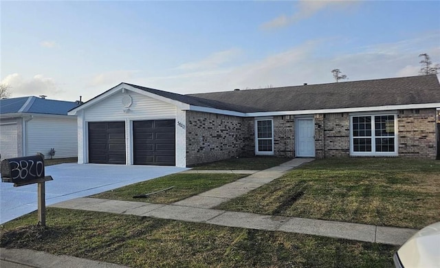 ranch-style home featuring a garage and a front yard