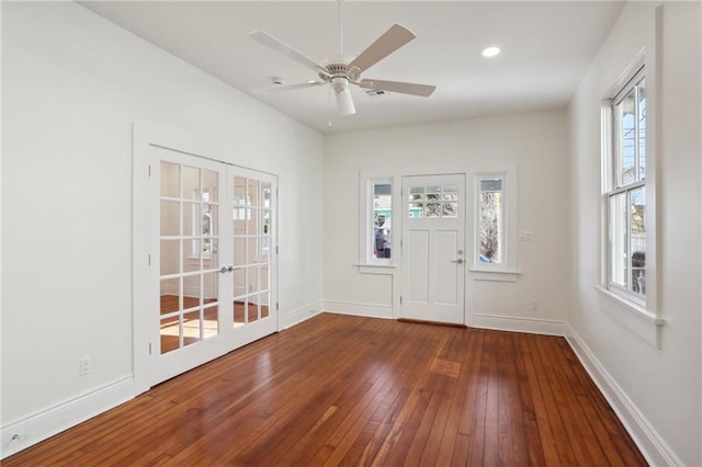 entrance foyer featuring dark wood-type flooring, ceiling fan, and french doors